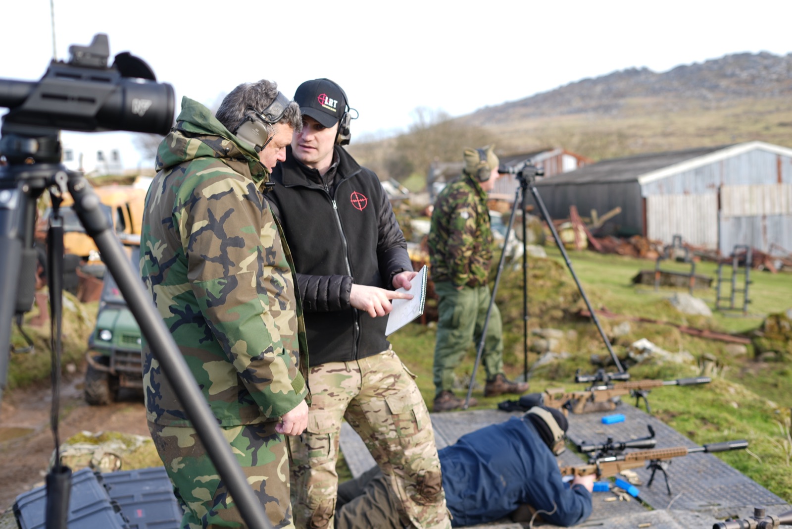 Adam, LRT director and instructor, coaching a shooter range-side on a South-West moorland range.